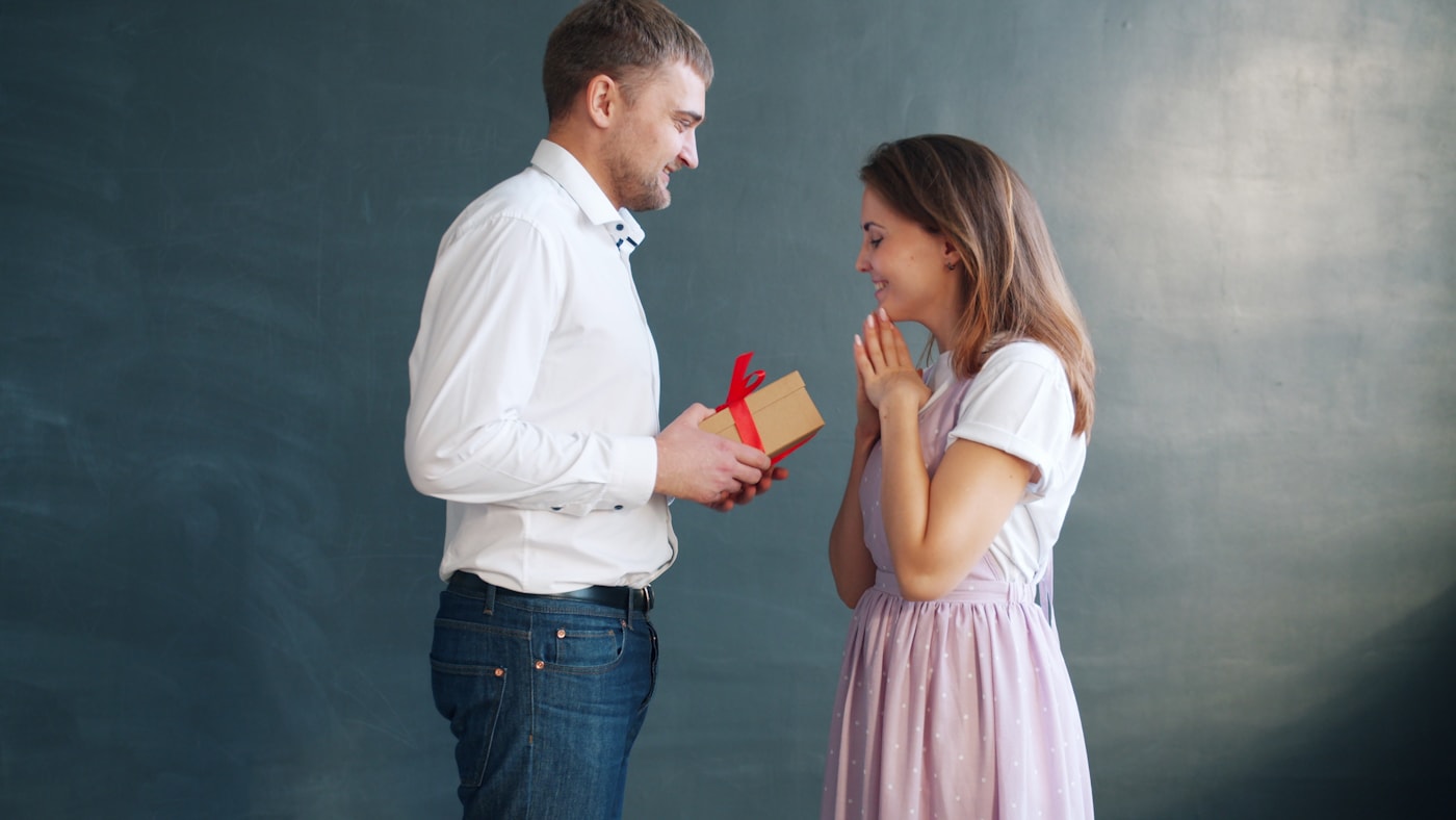 Happy couple exchanging a thoughtful gift