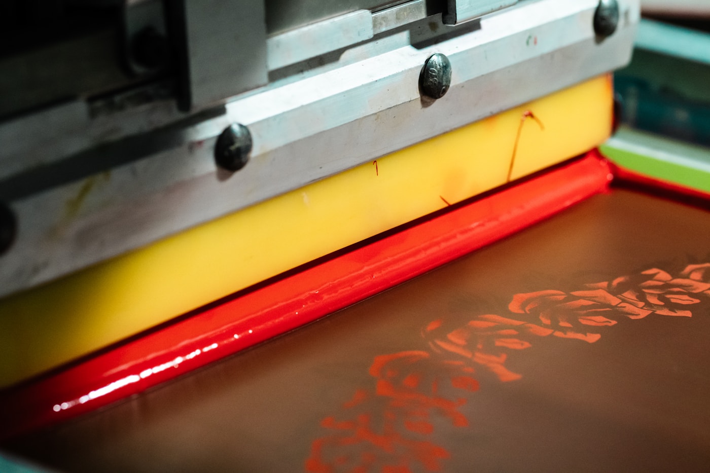 Screen printing process creating custom apparel designs